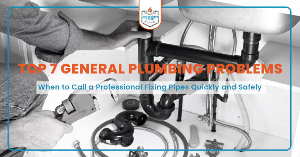 Plumber fixing pipes under sink with tools