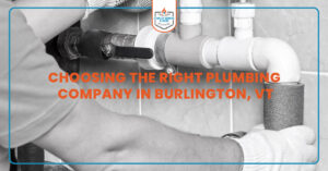 Professional plumber in Burlington, VT fixing kitchen sink with tools, representing reliable licensed plumbing services for homeowners.